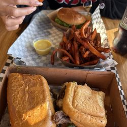 The made burger and the rib eye steak sandwich.