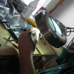 Our PC Guy - Using a magnifying lamp to fix a PC