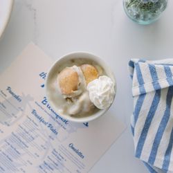 The Traveler - Homemade Banana Pudding -- creamy vanilla custard, ripe bananas & soft wafers topped with whipped cream. A Southern classic!