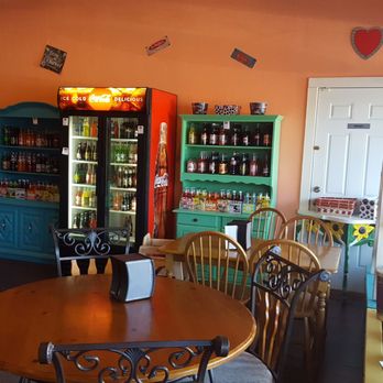 Too Good - a dining room with a table and chairs - Popcorn Shops Near Me - Commerce, Texas