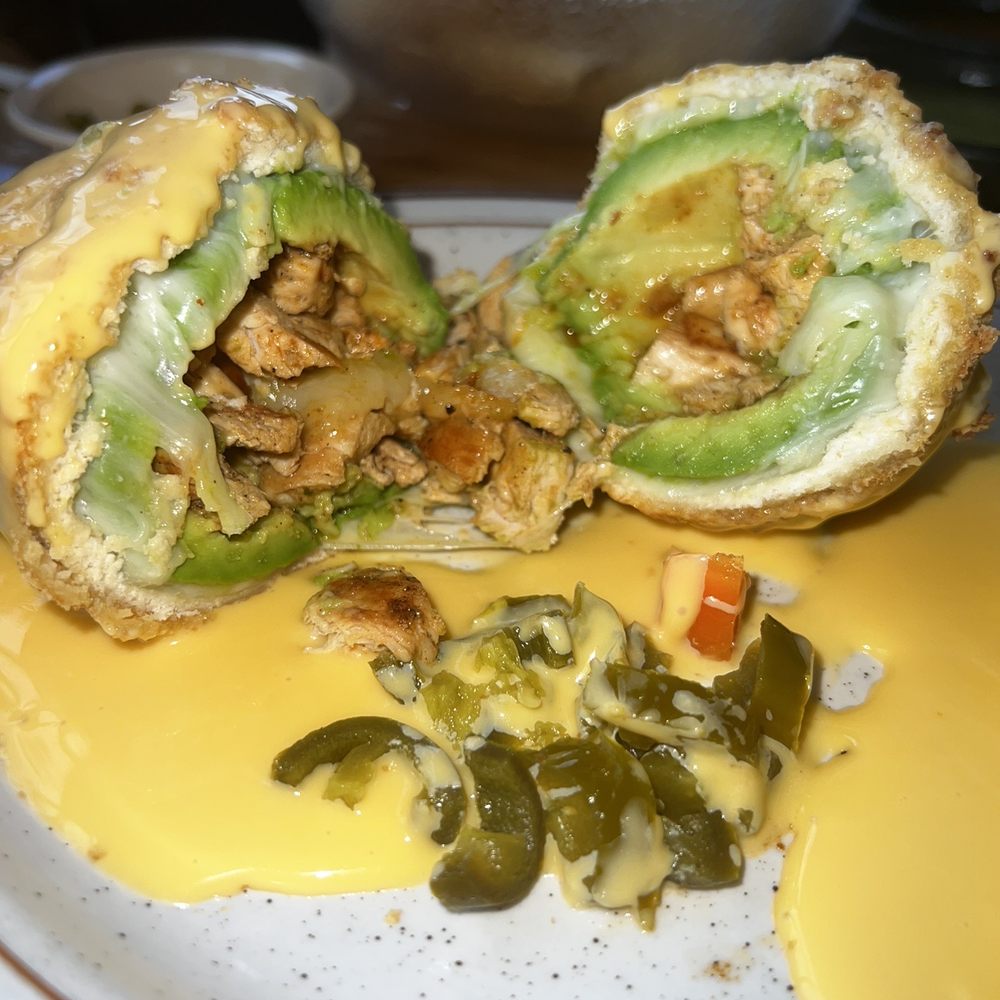 Las Flores Mexican Restaurant - Fajita chicken stuffed avocado.  Added queso. - Mexican Near Me - Wallis, Texas