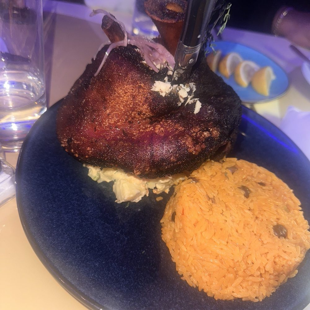 Don Coqui - Roast Pork   (Pernil) Marinated Roasted Pork served with Pigeon Pea Rice & Potato Salad and Garlic Mojo - Latin American Near Me - Edgewater, New Jersey
