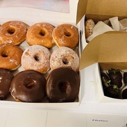 Glazed, chocolate dipped, sugar coated and one jelly filled powdered doughnut Glazed, chocolate dipped, sugar coated and one jelly filled powdered doughnut