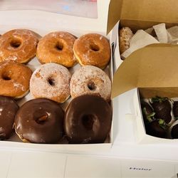Minos Bakery - Glazed, chocolate dipped, sugar coated and one jelly filled powdered doughnut
