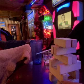 The Blue Moose Tavern - a man playing a video game - New American Near Me - Green Mountain Falls, Colorado