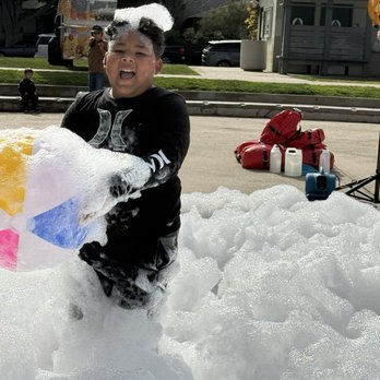 Epic Fun Foam Party - One of our kids playing throw the ball in bubbles - Bounce House Rentals Near Me - Los Angeles, California Epic Fun Foam Party - One of our kids playing throw the ball in bubbles - Bounce House Rentals Near Me - Los Angeles, California