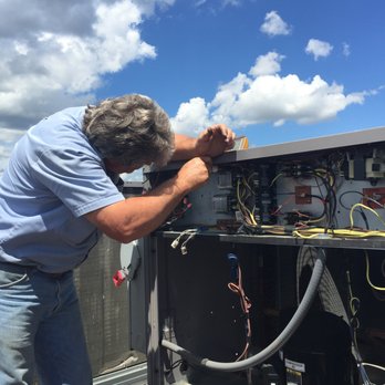 Metro Services - Servicing an industrial HVAC unit. - Heating & Air Conditioning/HVAC Near Me - Chattanooga, Tennessee Metro Services - Servicing an industrial HVAC unit. - Heating & Air Conditioning/HVAC Near Me - Chattanooga, Tennessee