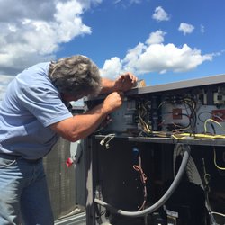 Metro Services - Servicing an industrial HVAC unit.