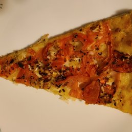 a slice of pizza on a plate