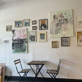 Cafe VSL - a table and chairs in a room - Coffee & Tea Near Me - Montreal, Quebec