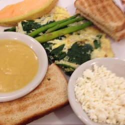 Garden Grille Cafe - Popeye omelet with feta and hollandaise on the side.