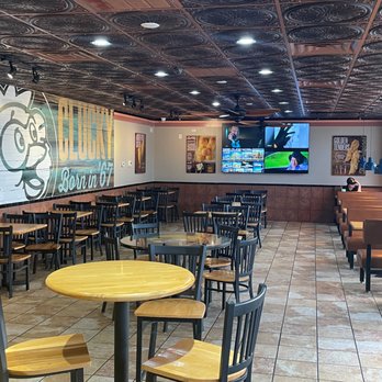 Golden Chick - tables and chairs in a restaurant - Fast Food Near Me - Plano, Texas Golden Chick - tables and chairs in a restaurant - Fast Food Near Me - Plano, Texas