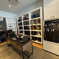 Coach - Men's area: belts, wallets, bags, shoes, clothing