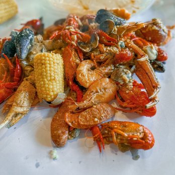 Kickin Kajun - a pile of crawfish and corn on a table - Cajun/Creole Near Me - Renton, Washington