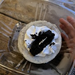 a cupcake in a plastic container