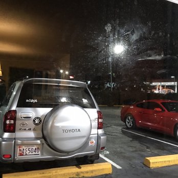 Americas Best Value Inn - My Ella (the Rav4)  outside my room.  Sliding glass window could use a....cleaning? - Hotels Near Me - Dillon, South Carolina