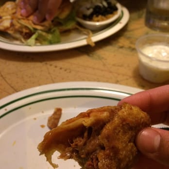 Flanigan's - Hallandale - Inside of the rib Eggrolls. Chipotle chicken sandwich in background. We are here three times on vacation. - American Near Me - Hallandale Beach, Florida