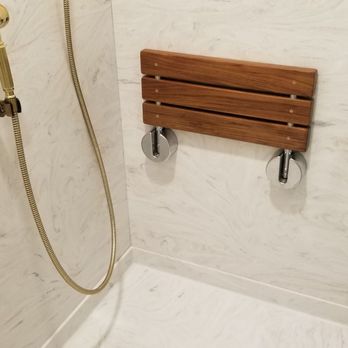 Chermak Construction - a shower with a wooden seat - General Contractors Near Me - Edmonds, Washington Chermak Construction - a shower with a wooden seat - General Contractors Near Me - Edmonds, Washington