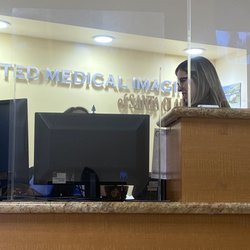 United Medical Imaging - Santa Clarita - Receptionist and radiologist talking about patients in waiting room.