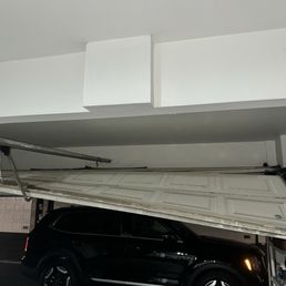 My damaged garage door. My damaged garage door.