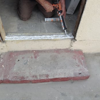 Doug Gillespie Doors - Installation of silicone caulking to tye the threshold to the concrete. The caulking will dry clear. - Door Sales/Installation Near Me Doug Gillespie Doors - Installation of silicone caulking to tye the threshold to the concrete. The caulking will dry clear. - Door Sales/Installation Near Me