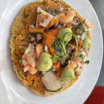 Holbox - Smoked Kanpachi Tostada     house smoked kanpachi, baja bay scallops, wild shrimp, arbol-peanut-soy sauce   9 - Latin American Near Me - Los Angeles, California