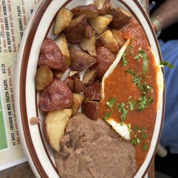 Rancho Grande Cafe - Huevos rancheros with cilantro added on. The red sauce is delish! - Mexican Near Me - Waco, Texas