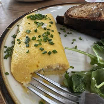 Arcade Coffee Roasters - Boursin French omelette $12 boursin cheese, caramelized shallots, arugula, sourdough - Bakeries Near Me - Riverside, California