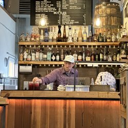 Clyde's Corner - Bar area w expert bartender, tending to his bar
