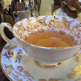 Neverland Tea Salon - Pretty gold tea cup (they change your set with each new tea selection) - Coffee & Tea Near Me - Vancouver, British Columbia Neverland Tea Salon - Pretty gold tea cup (they change your set with each new tea selection) - Coffee & Tea Near Me - Vancouver, British Columbia