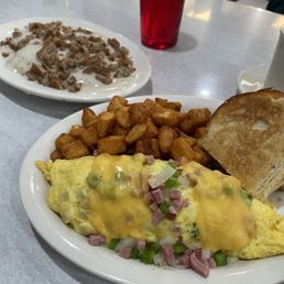 Western omelette, home fries, biscuit and sausage gravy. Western omelette, home fries, biscuit and sausage gravy.