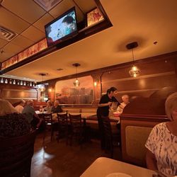 Dina's Family Restaurant - Another angle of the dining room and half of my friend. Not sure if she wanted to be in the pics lol.