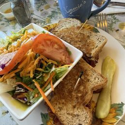 Pastrami Reuben and side salad. Pastrami Reuben and side salad.