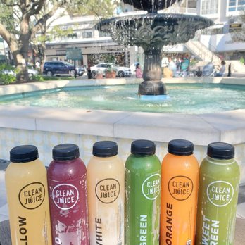 Clean Juice Hyde Park - a row of clean juices in front of a fountain - Juice Bars & Smoothies Near Me - Tampa, Florida