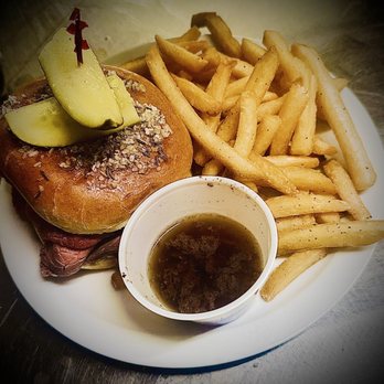 The West End Inn - Beef on Wick, slow roasted top round sliced on a kimiwick roll topped with pickles, house seasoned fries and Au jus - New American Near Me - Hamburg, New York