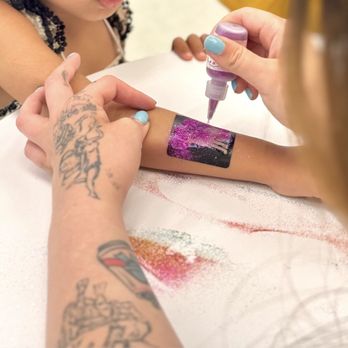 Pacific Face Painting - Getting a glitter tattoo! - Face Painting Near Me Pacific Face Painting - Getting a glitter tattoo! - Face Painting Near Me