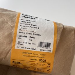 a package of food wrapped in brown paper a package of food wrapped in brown paper