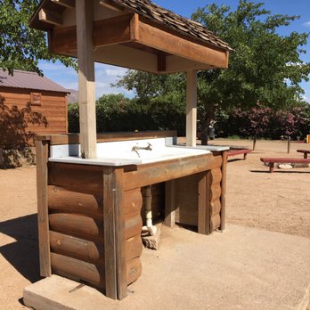 Kingman KOA - Wash sink near tent site. Bathrooms in back of it. - Campgrounds Near Me - Kingman, Arizona