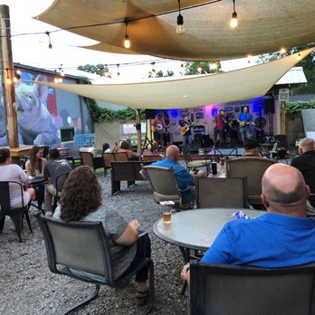 The Thirsty Pig Craft Beer Taproom - a band playing on stage - Wine Bars Near Me - Dothan, Alabama The Thirsty Pig Craft Beer Taproom - a band playing on stage - Wine Bars Near Me - Dothan, Alabama