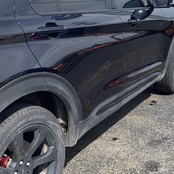 Wyatt Ford - Circled hailed damage repair areas by the dealer paint shop. - Car Dealers Near Me - Manistee, Michigan