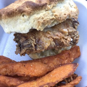 Stoneyard Brewing - Honey fried chicken on a biscuit with sweet fries - two biscuits are served with the meal - Bars Near Me Stoneyard Brewing - Honey fried chicken on a biscuit with sweet fries - two biscuits are served with the meal - Bars Near Me