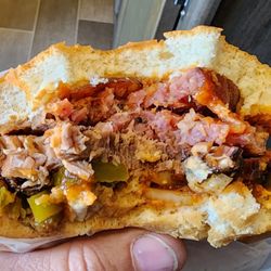 Brisket and sausage sandwich inside.