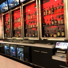 a man standing at the bar a man standing at the bar