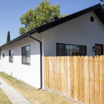 Cesar's Painting - After lace textured stucco was removed with fine sand stucco finish and white paint! - Painters Near Me