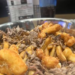 Albert G's Barbecue Tulsa Hills - G's Debris, fried cheese curds, French fries, brisket and brown gravy.