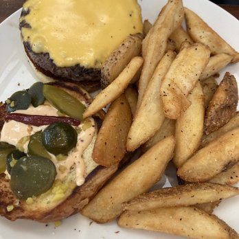 Emeril’s Table - Emeril's burger with fries - Seafood Near Me - Kenner, Louisiana Emeril’s Table - Emeril's burger with fries - Seafood Near Me - Kenner, Louisiana