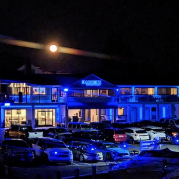 Harpers Waterfront - cars parked in front of a hotel at night - Seafood Near Me - Edgewater, Maryland Harpers Waterfront - cars parked in front of a hotel at night - Seafood Near Me - Edgewater, Maryland