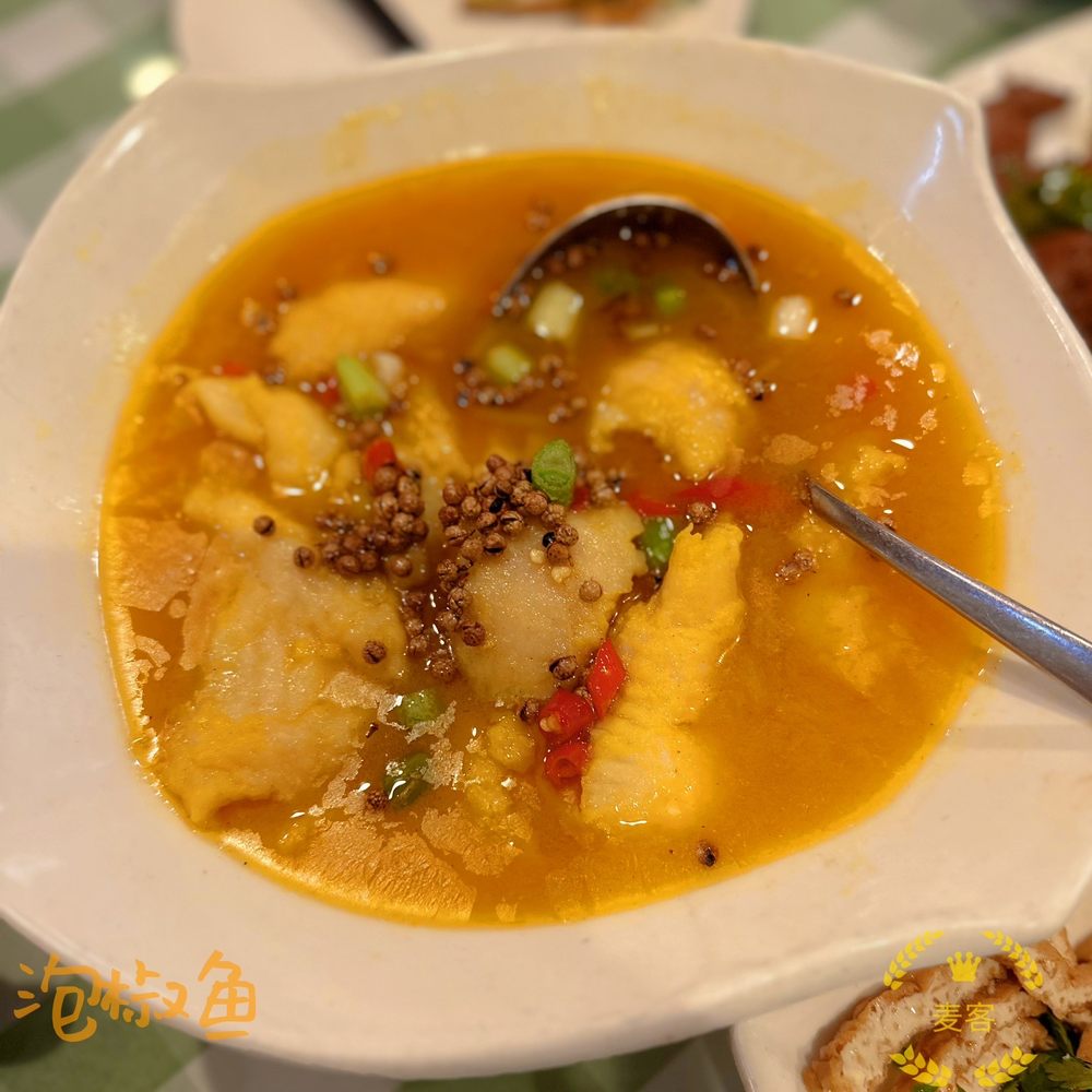 Green Tea Restaurant - a bowl of soup with a spoon in it - Seafood Near Me - Stony Brook, New York