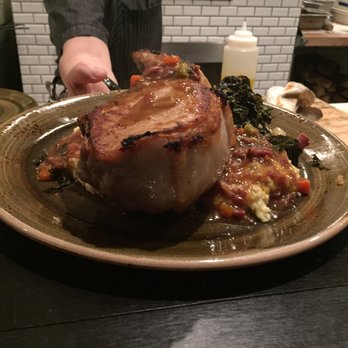 The Commoner - Huge pork chop looked amazing but unfortunately was not mine. A perk of sitting by the chefs! - New American Near Me - Pittsburgh, Pennsylvania The Commoner - Huge pork chop looked amazing but unfortunately was not mine. A perk of sitting by the chefs! - New American Near Me - Pittsburgh, Pennsylvania