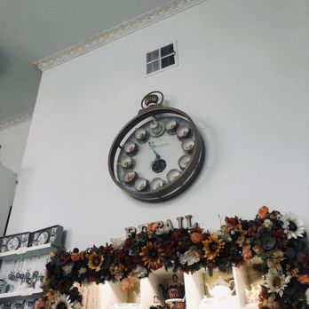 The Tea Room Experience - Clock, tea pot display. - Tea Rooms Near Me - Orlando, Florida